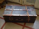 an old suitcase sitting on the floor in a room