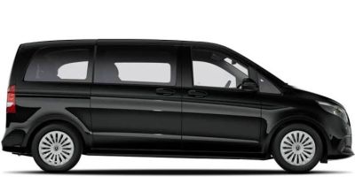 the black van is parked on a white surface