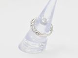 a ring that is sitting on top of a clear object