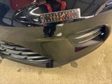 a close up of a car ' s front bumper with a ruler on it