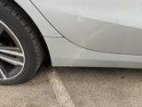 a close up of a car ' s wheel with a sticker on it