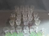 a lot of glasses that are sitting on a table