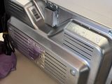a silver machine sitting on a table in a room