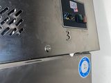 an image of a stainless steel refrigerator in a kitchen