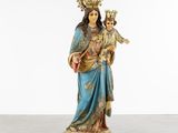 a statue of a woman holding a child in her arms