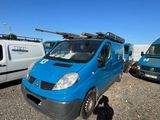 a blue van that is parked next to a white van