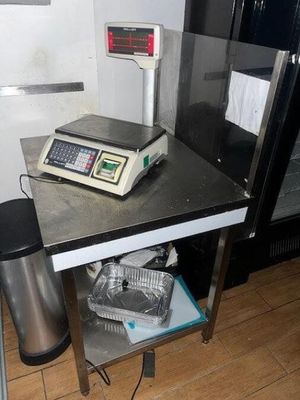 an image of a scale on a table in a kitchen