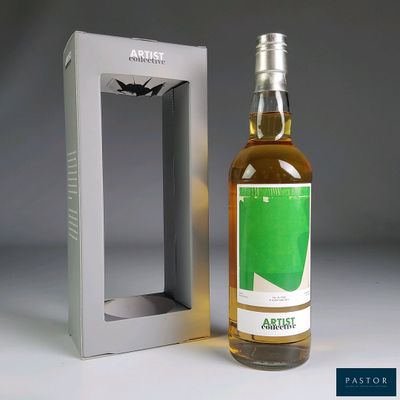 a bottle of wine that is sitting next to a box