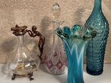 three vases on the table next to each other
