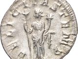 an old silver coin with a man holding a sword