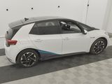 the bmw i3 is parked in the garage with its door open