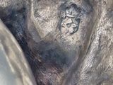 a close up of a silver statue of a man and a woman