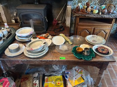 a table with many plates and bowls on it