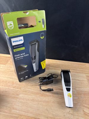 une boîte de tondeuses à cheveux Philips posée sur une table