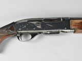 an old shotgun with a wooden handle on a white surface