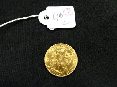 une image représentant une pièce d'or à laquelle est accrochée une étiquette indiquant son prix
