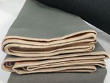 three different colors of fabric stacked on top of each other