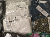 many different types of clothes in a plastic bag