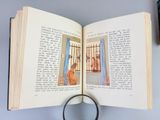 a magnifying glass on top of an open book