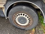 a flat tire on the side of a truck