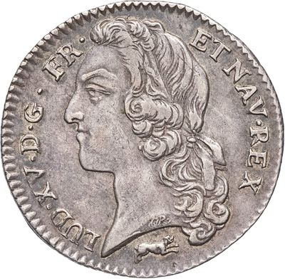 gros plan d'une pièce de monnaie sur laquelle figure un visage de femme