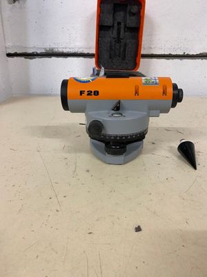 a close up of a surveying device on a table in a room
