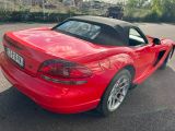 a red sports car parked in a parking lot