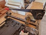a picture of a clamp and a tool box on the floor