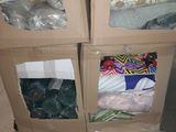 three boxes with different items in them on a pallet