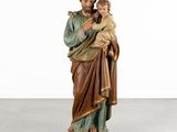 a statue of jesus holding a child in his arms