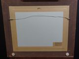 an old picture of a picture frame with a picture hanging on the wall