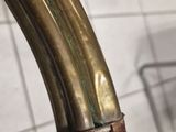 a close up of a metal handle on a toilet