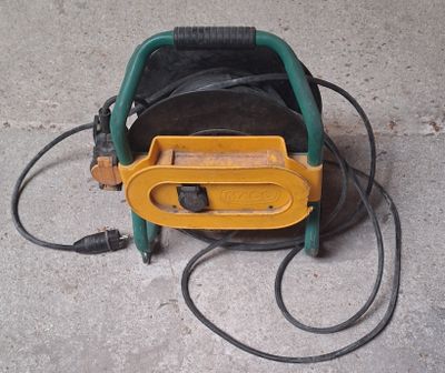 a hose that is connected to a reel on the ground