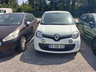 three cars parked in a parking lot next to each other