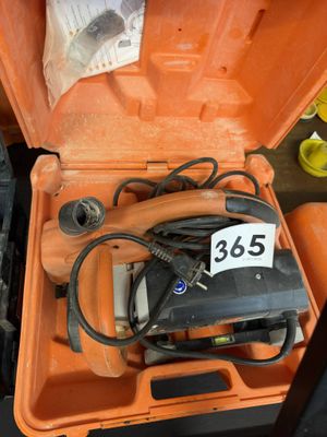 an orange tool box with a charger and a charger in it