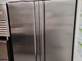 a stainless steel refrigerator in a kitchen with a refrigerator freezer