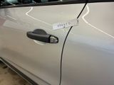 a close up of a car door handle with a sticker on it