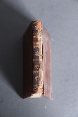 an old book sitting on top of a table