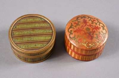 pair of decorative wooden boxes with floral designs on them on a gray surface