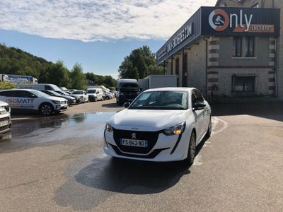 a white car that is parked in front of a building