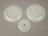 three plates that are sitting on a table