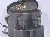 a black box with a pair of binoculars in it