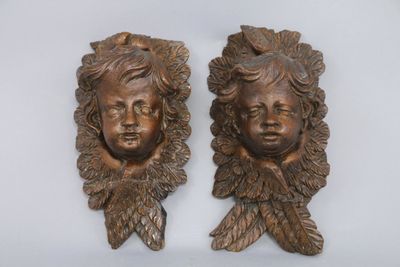 pair of antique bronze wall sculptures of two children ' s heads
