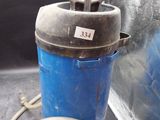 a blue canister with a hose attached to it