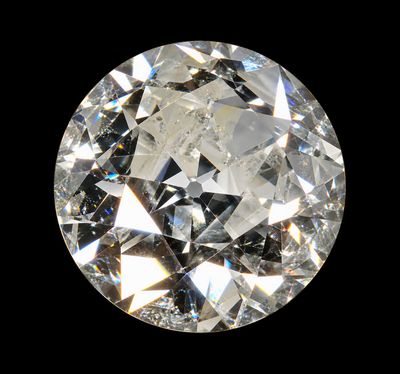a close up of a diamond on a black background