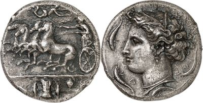 a silver coin with an image of a horse on it