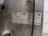 a label on the side of a machine that is sitting on the floor