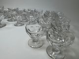 a lot of glasses that are sitting on a table