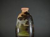 a vase that has a picture of a tree on it
