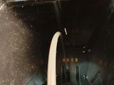 an image of a close up of a toilet with a hose coming out of it